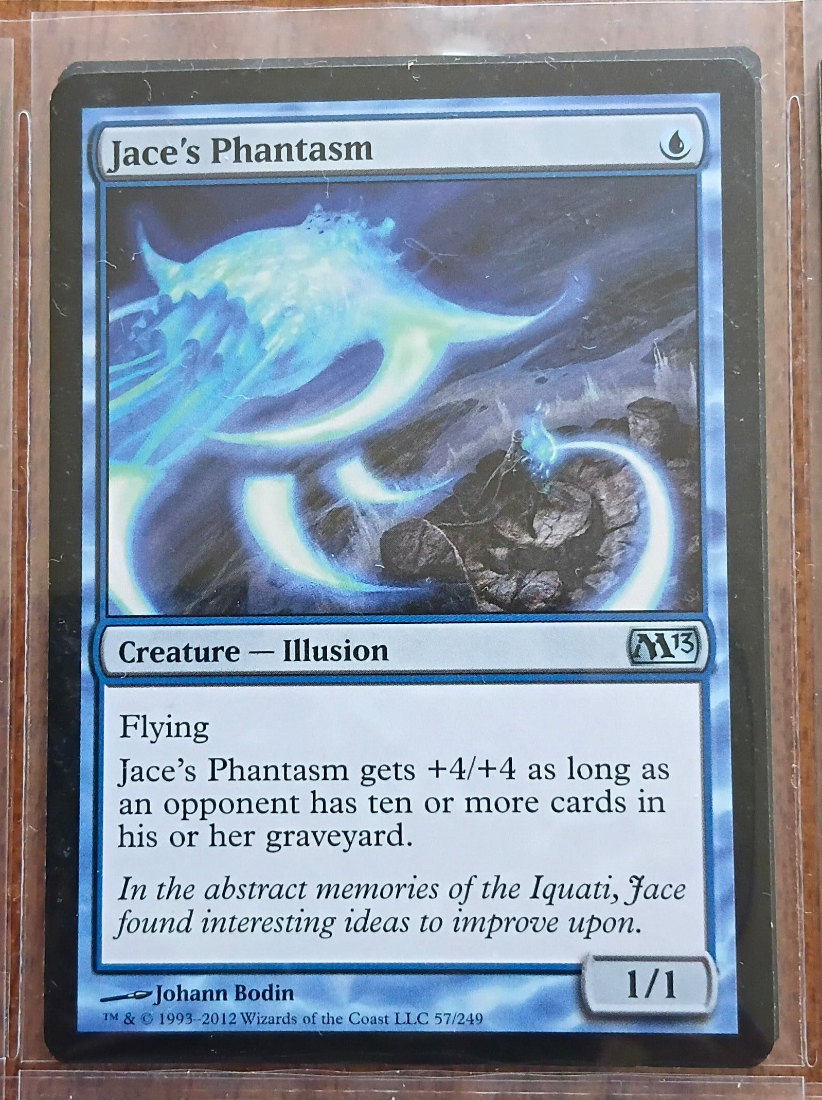 Trading card featuring 'Jace's Phantasm' with blue and black design
